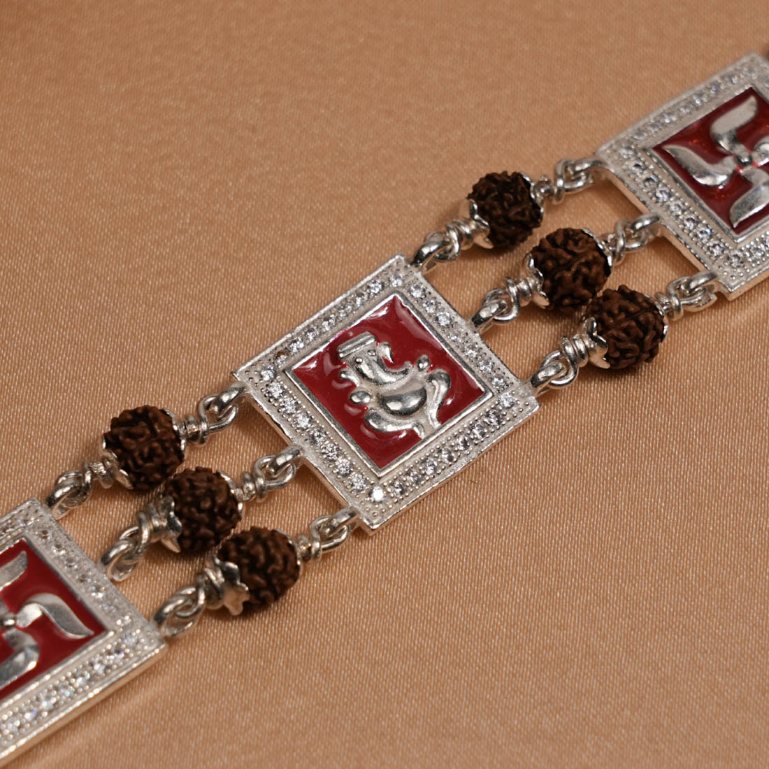 Rudraksha Silver Ganesh With Swastik Triple Line Bracelet
