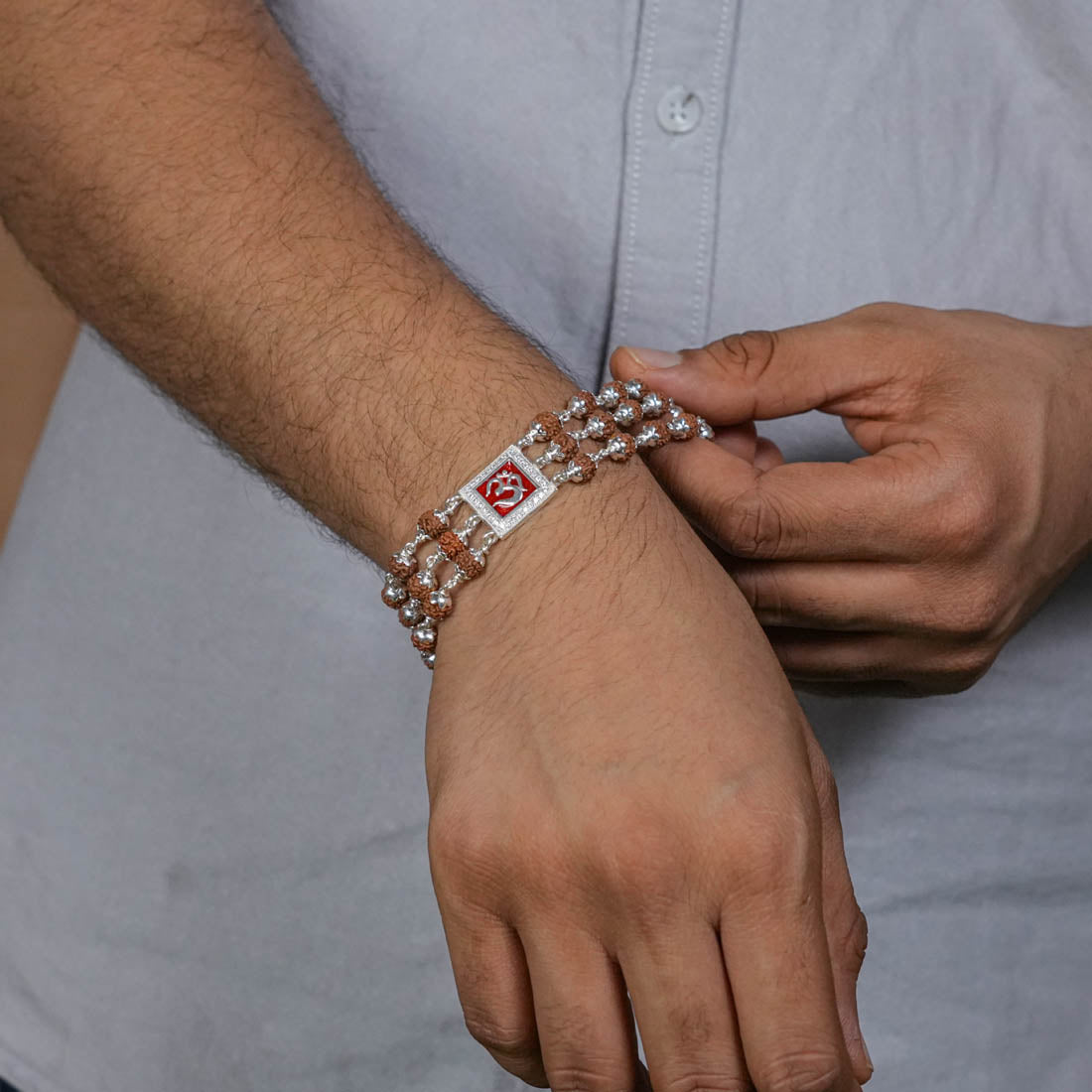 Orignal Rudraksha Silver Om in Red Triple Line Bracelet
