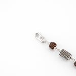 Silver Rakhi with Rudraksha and Hollow Cylindrical Beads