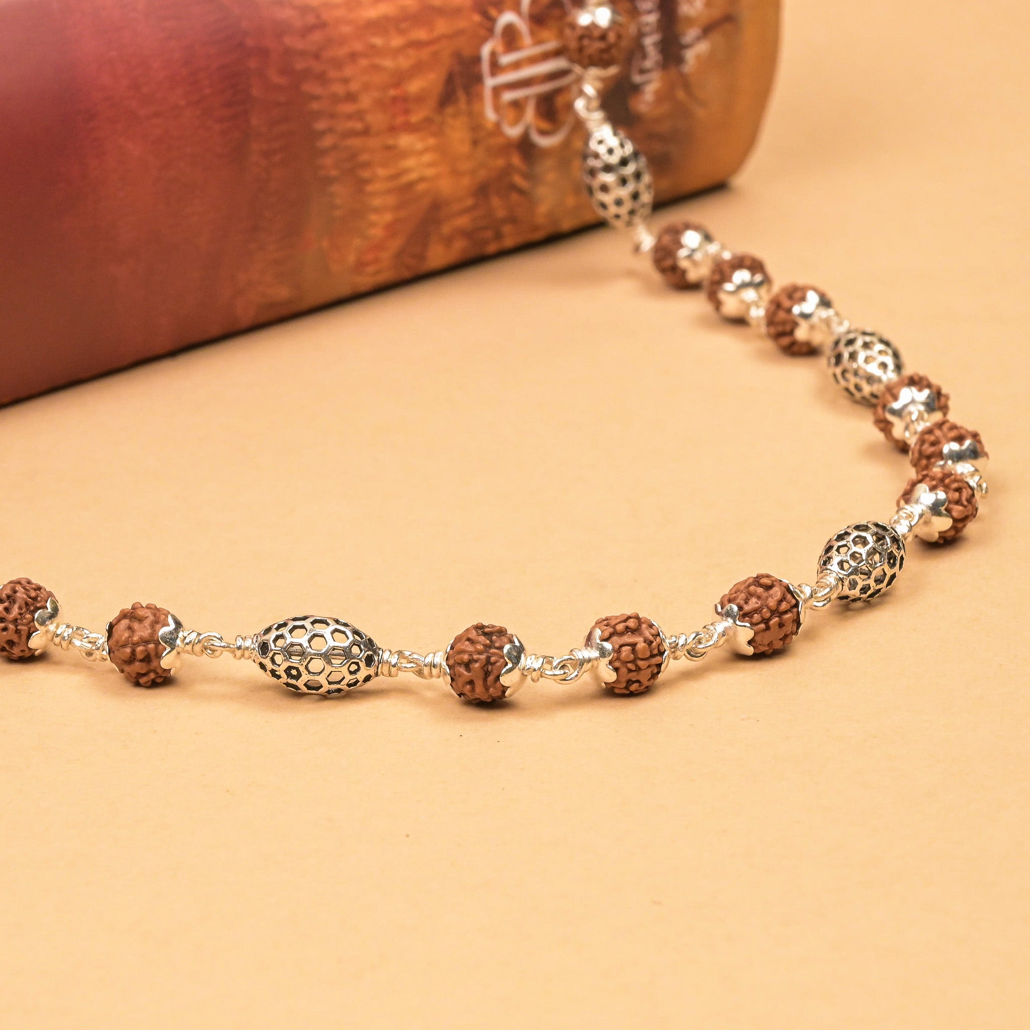 Rudraksha With Perforated Oval  Silver Beads Mala
