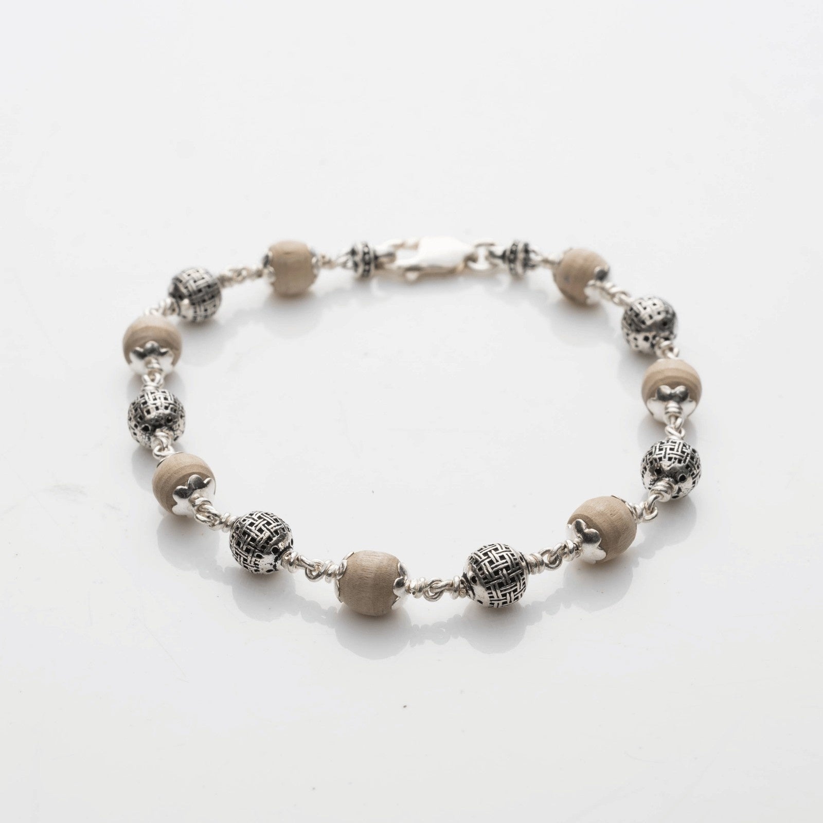 Tulsi with Silver Textured Round Beads Bracelet