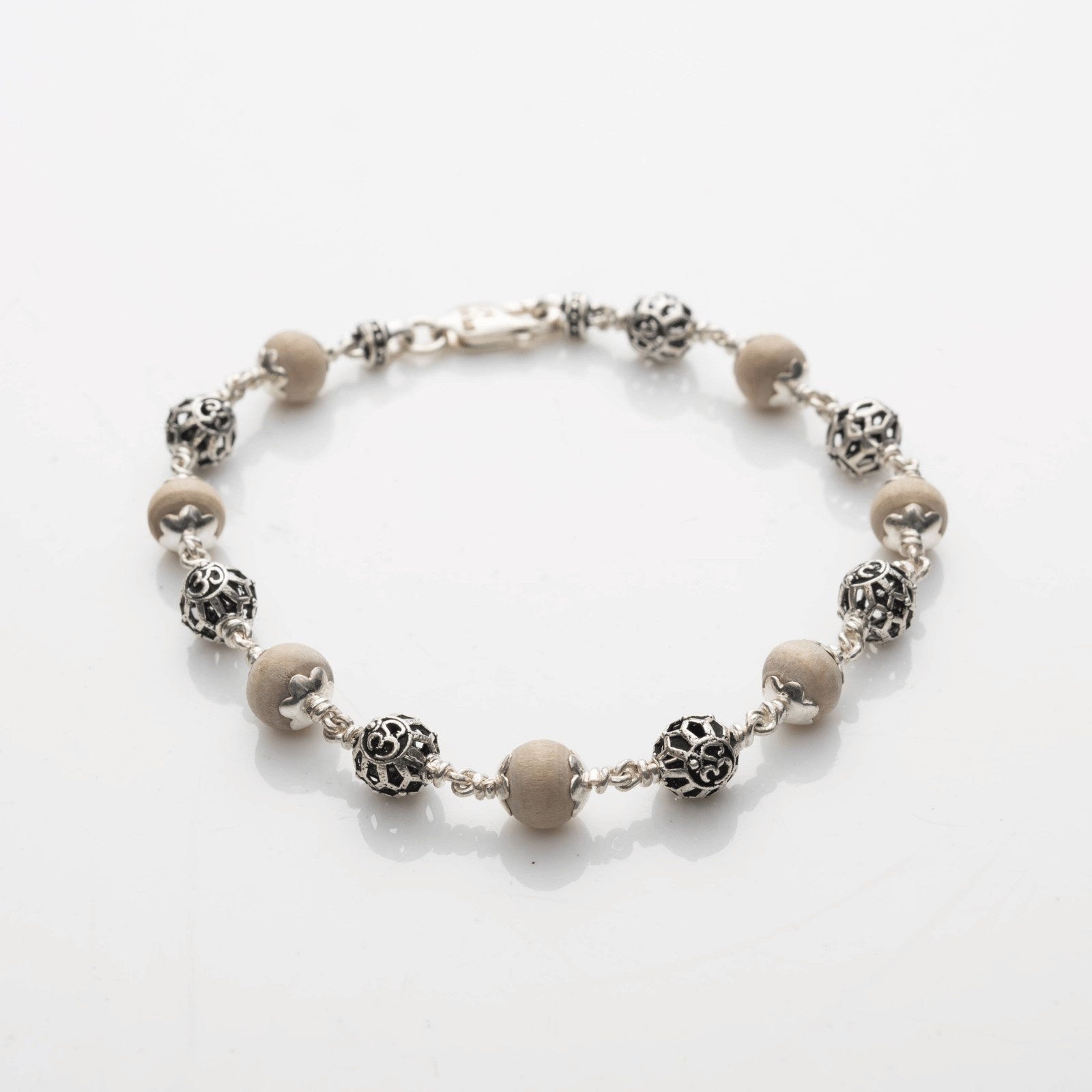 Tulsi with Round Om Beads Silver Bracelet
