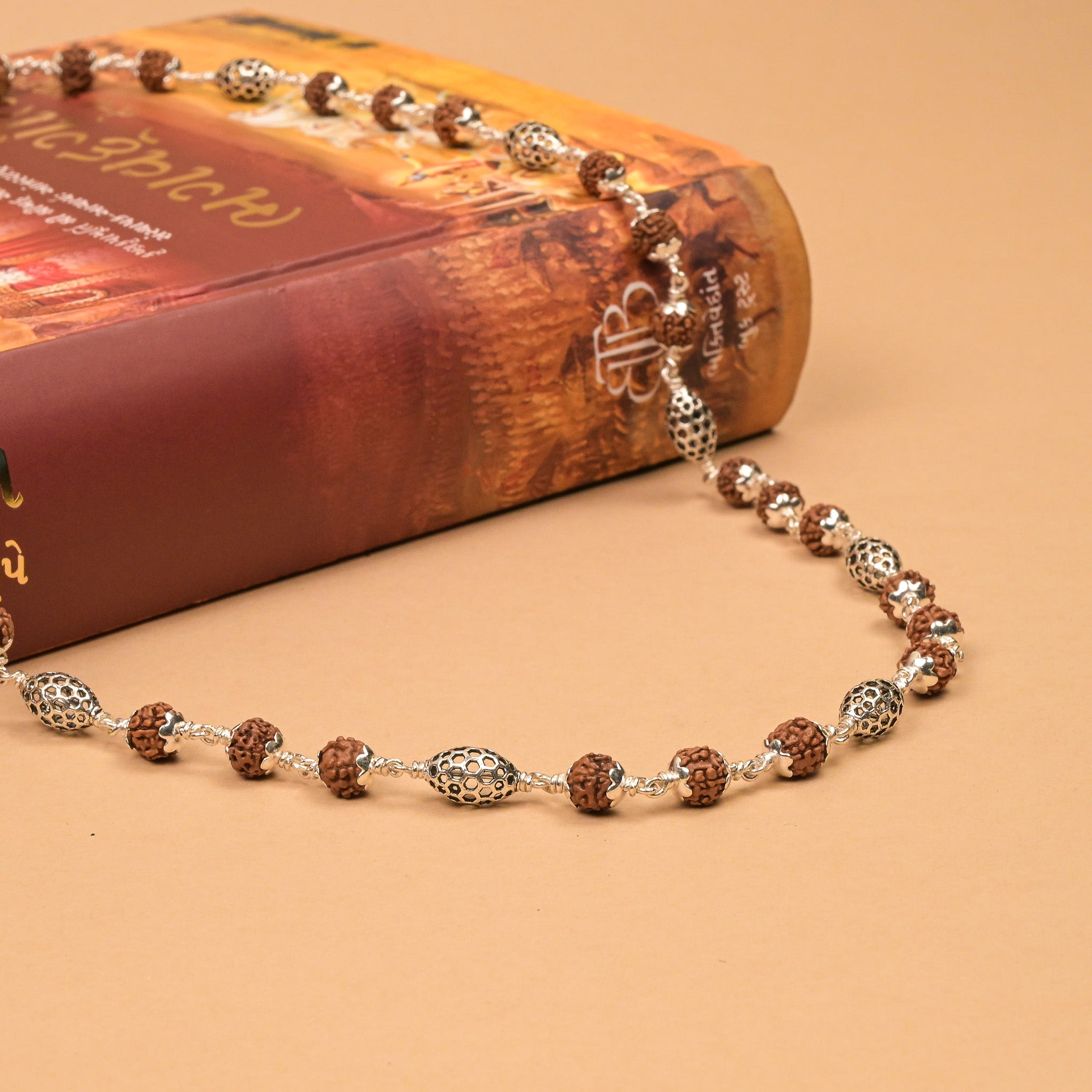 Rudraksha With Perforated Oval  Silver Beads Mala