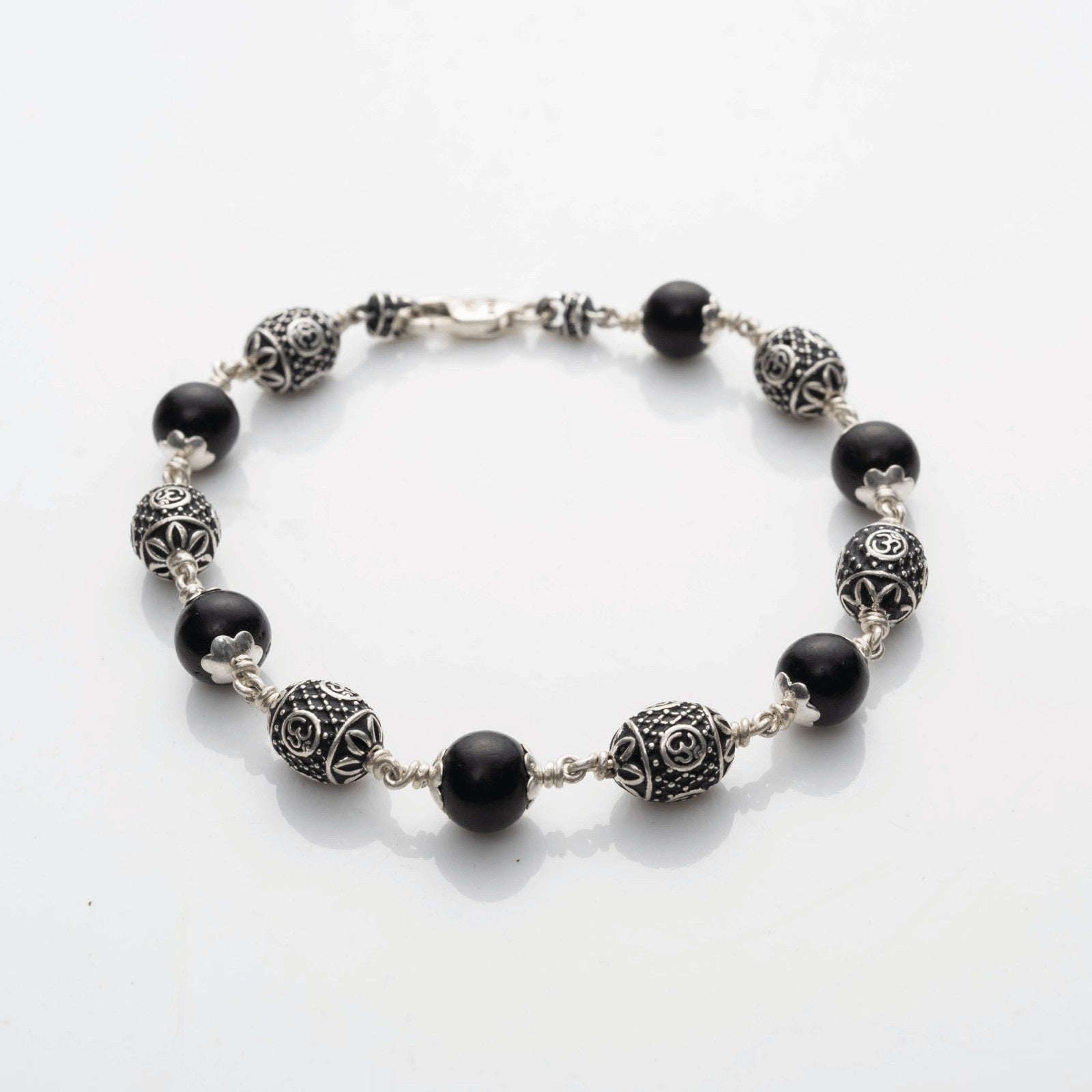 Karungali With Oval Om Beads Silver Bracelet