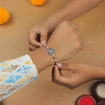 Pure Silver Rakhi with Ganesh in a Designer Circular Sphere and Single Line Rudraksha