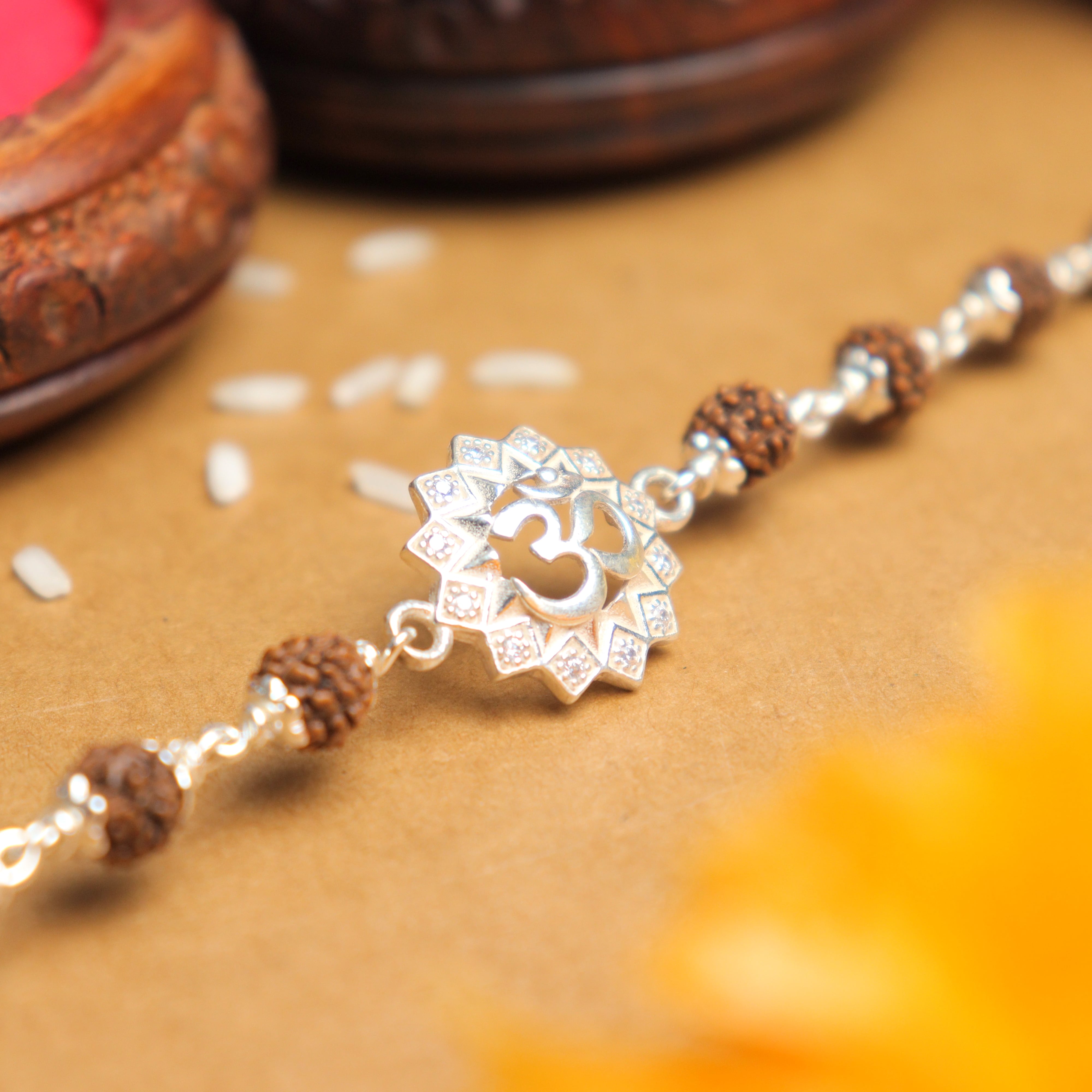Pure Silver Rakhi with Om in a Concave Sphere and Single Line Rudraksha
