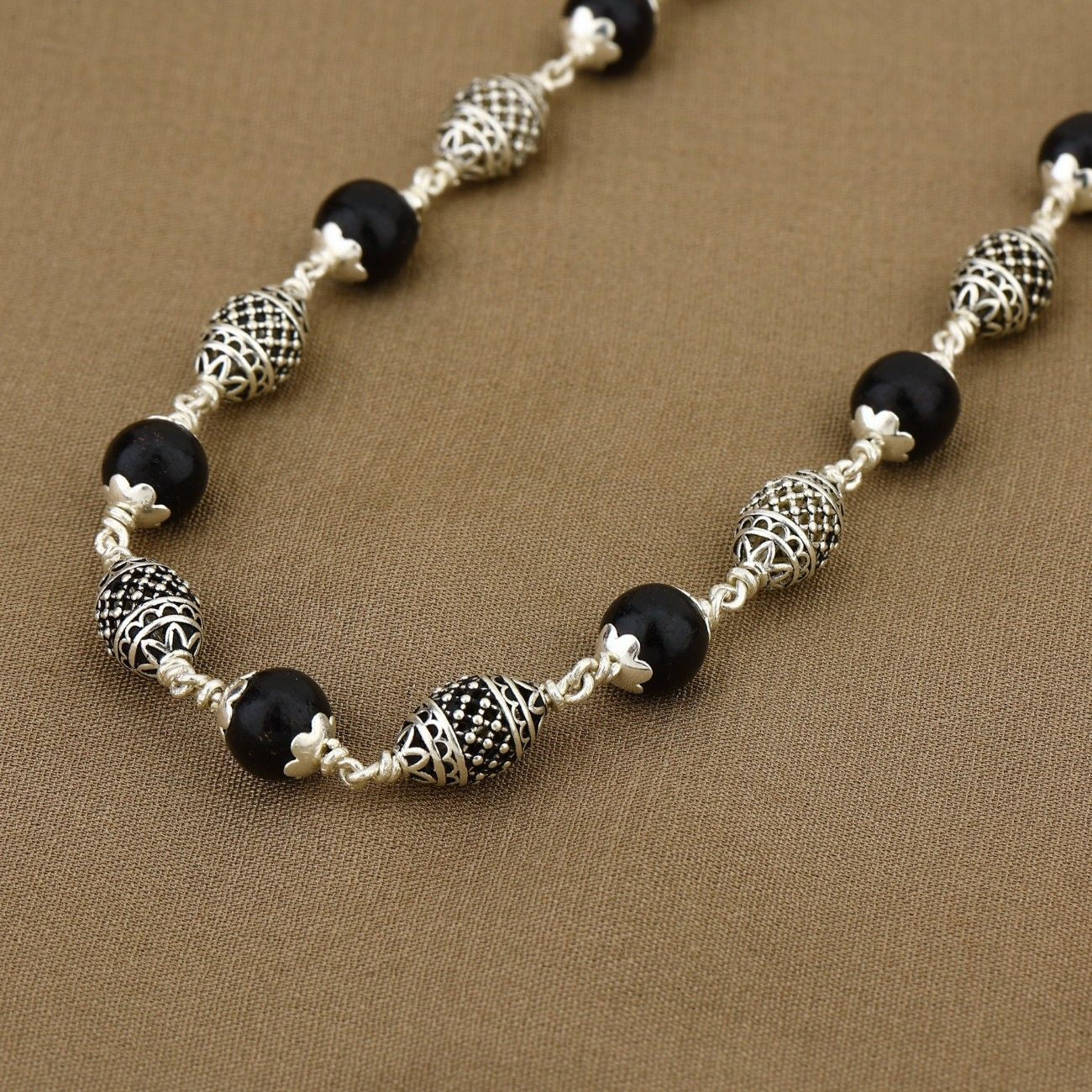 Original Karungali mala featuring dome silver beads for spiritual wear