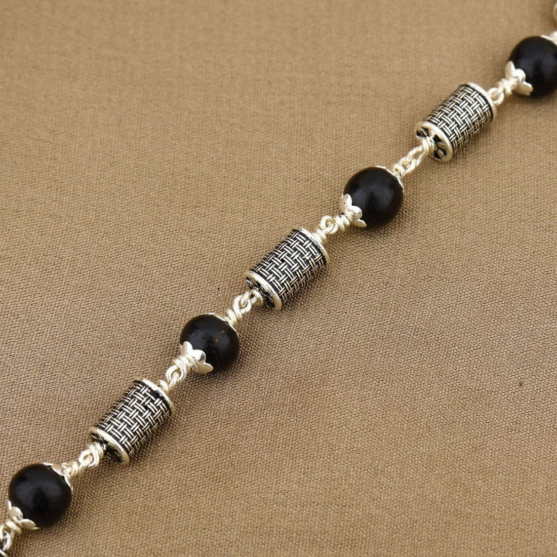 Karungali with Hollow Cylindrical Silver Bracelet